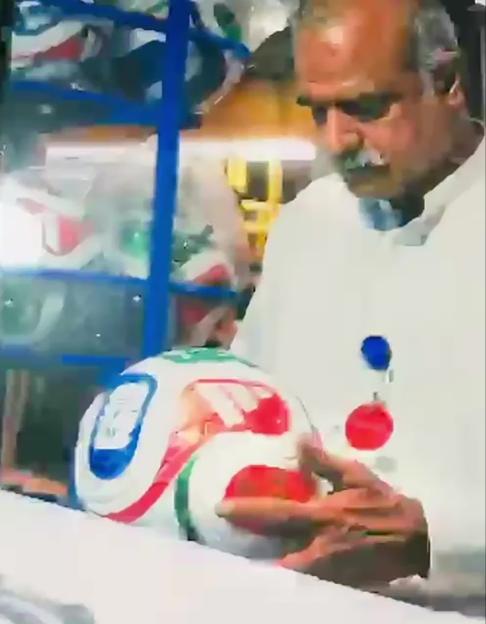 A worker in Pakistan assembling a FIFA World Cup football.
