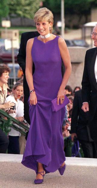 Diana, Princess of Wales, in a purple Versace gown and Jimmy Choo shoes, arrives at a gala dinner at the Field Museum of Natural History in Chicago.
