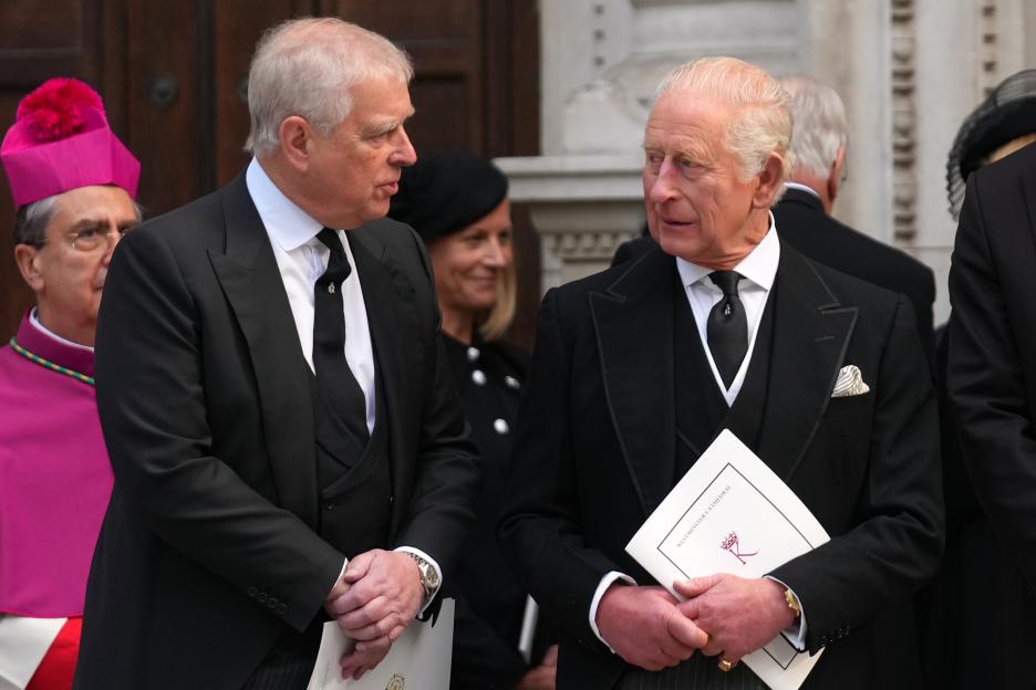 Prince Andrew and King Charles III leave Westminster Cathedral.