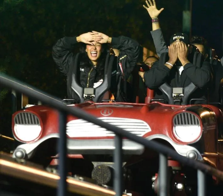 Maya Jama on a theme park ride with friends.