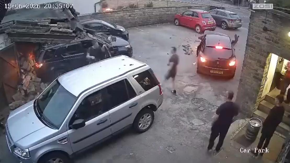 Bystander Takes Action as Car Crashes in Reverse into Pub, Causing Destruction