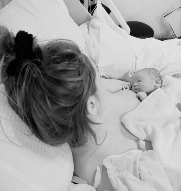 Dianne Buswell with her newborn son, Bowden Mark Richard Sugg, sleeping on her chest.