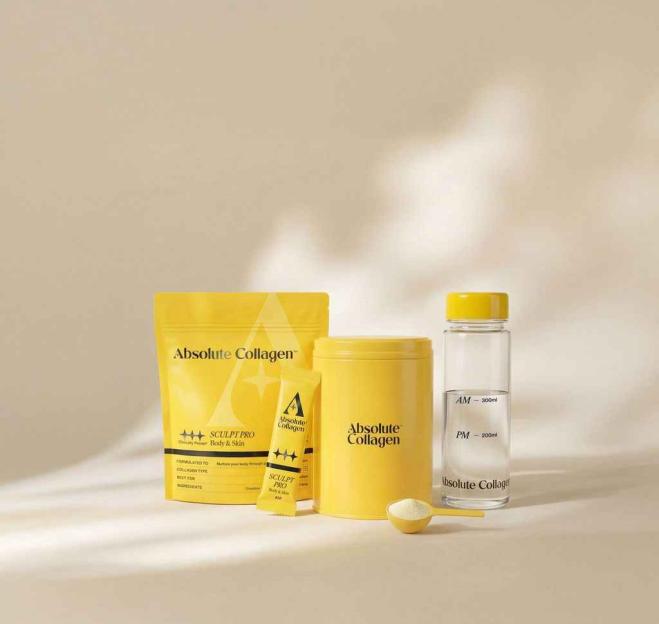 Absolute Collagen products including a yellow pouch, a yellow canister, a small packet, a yellow spoon with powder, and a glass bottle.