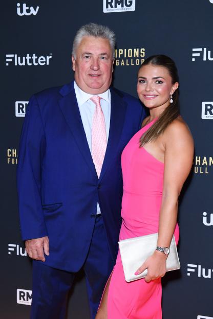 Paul and Megan Nicholls at a red carpet event.