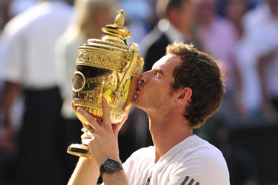 Andy Murray kissing the Wimbledon winner's trophy.