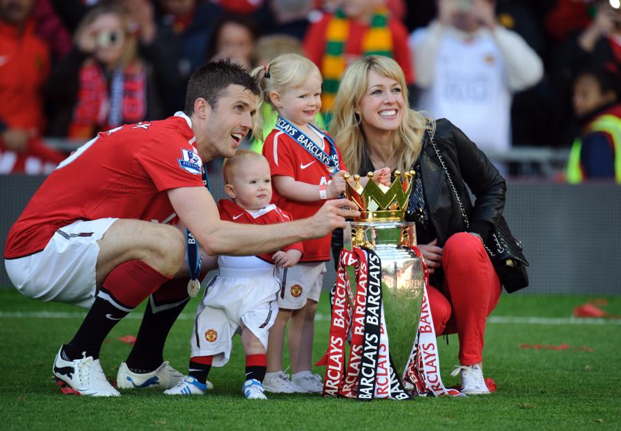 Michael Carrick of Manchester United with his wife Lisa and children Jacey and Louise with the FA Barclays Premier League trophy.