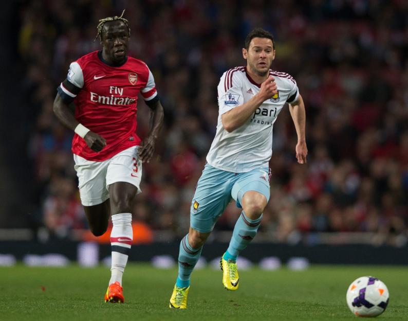 Bacary Sagna of Arsenal and Matt Jarvis of West Ham United during a Premier League match.