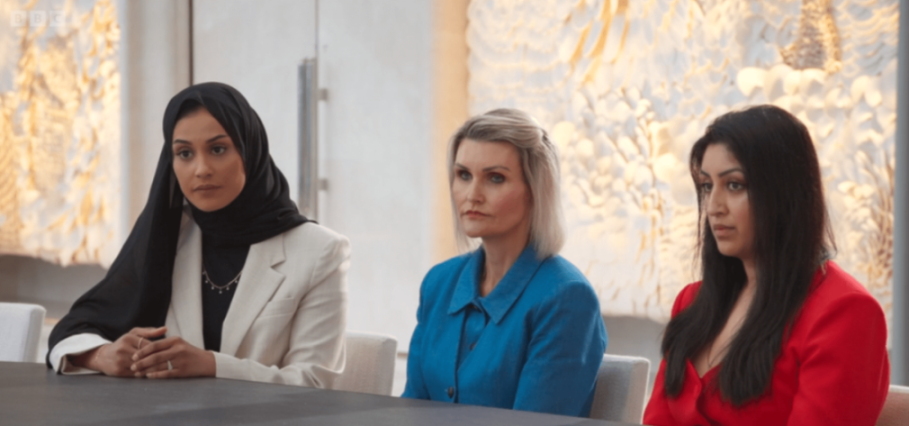 Three women looking attentively at something off-camera.