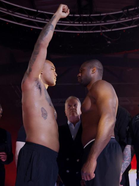 Fabio Wardley with his arm raised and Daniel Dubois face off at a weigh-in.