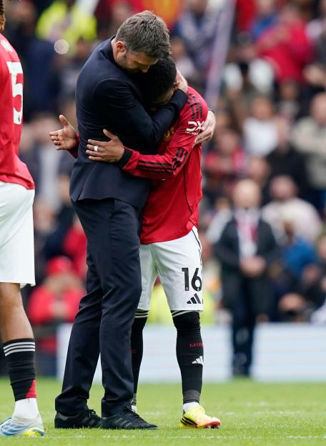Manchester, England, 3rd May 2026. Michael Carrick head coach of Manchester United hugs Amad Diallo of Manchester United during the Manchester United vs Liverpool Premier League match at Old Trafford, Manchester. Picture credit should read: Andrew