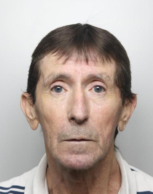 Mugshot of a male gangster.
