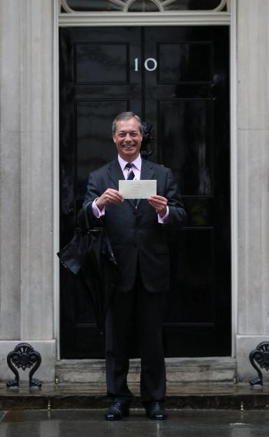 Leader of the Brexit Party Nigel Farage delivers a letter to Downing Street in London.