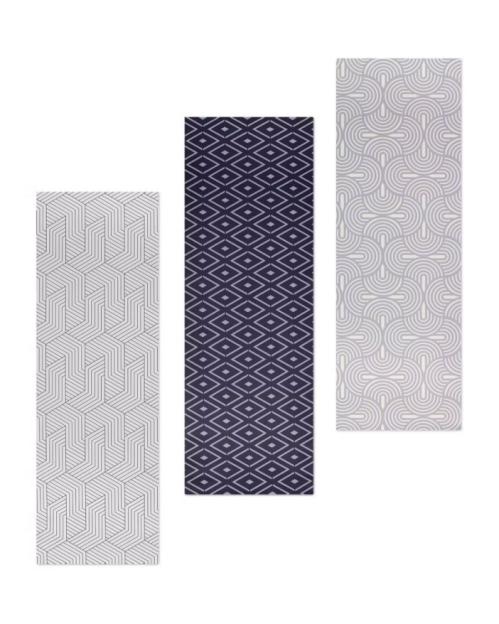 Three patterned rectangular mats, one with a geometric striped pattern, one with a dark blue diamond pattern, and one with a light gray curved pattern.