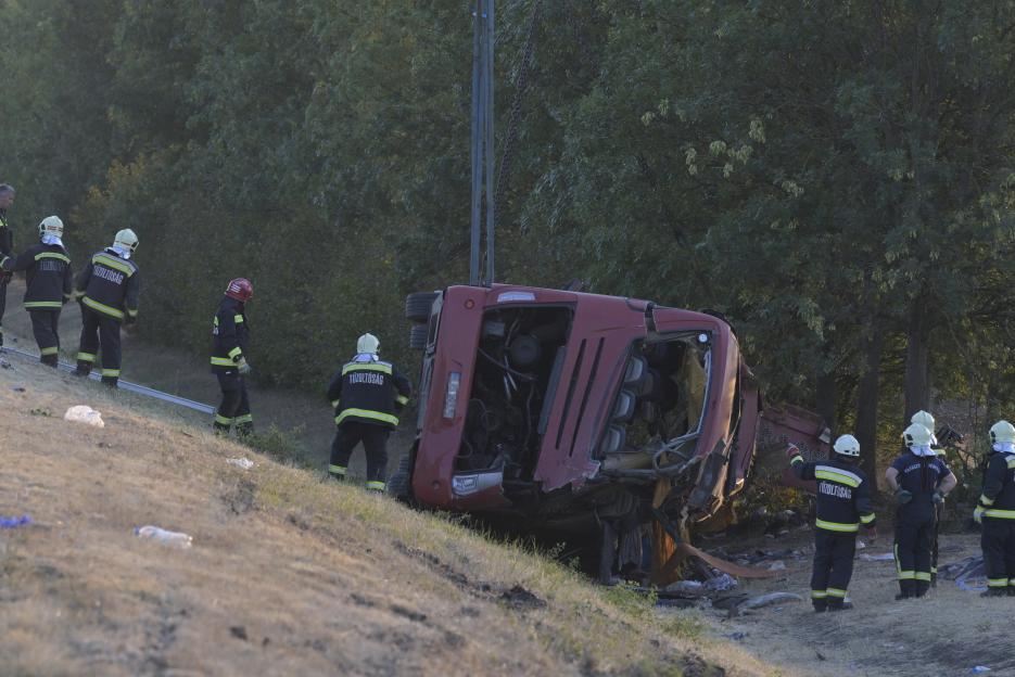 epa13173207 Emergency services attend the scene after a tourist bus travelling from Poland went off the road and overturned in a ditch along the M3 motorway between Mezokeresztes and Mezonagymihaly...