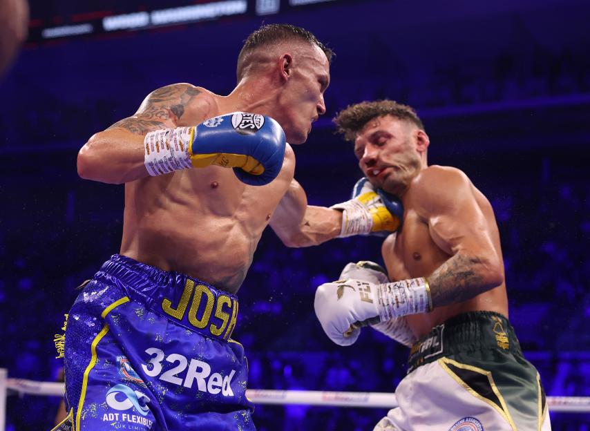 Leigh Wood punching Josh Warrington in the face during a boxing match.