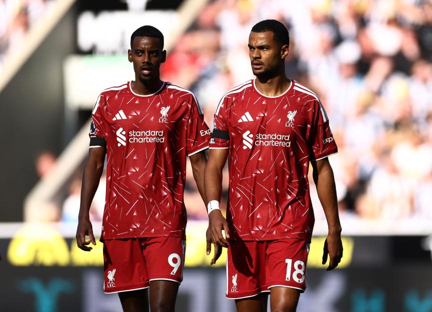 Liverpool's Alexander Isak and Cody Gakpo in red jerseys.