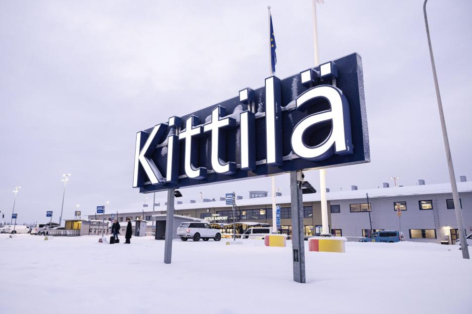 The word "Kittilä" in white letters with dark blue trim, set against the snowy backdrop outside Kittilä airport.