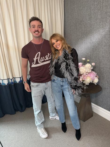 Kylie Minogue and Jack Hardwick smiling for a photo.