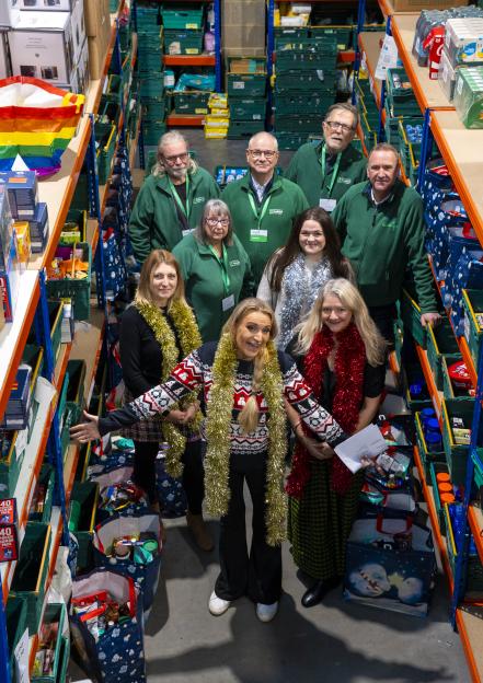 Daisy May Cooper and other volunteers at a food bank for Christmas.