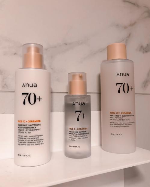 Three Anua Rice 70+ Ceramide skincare products on a shelf.