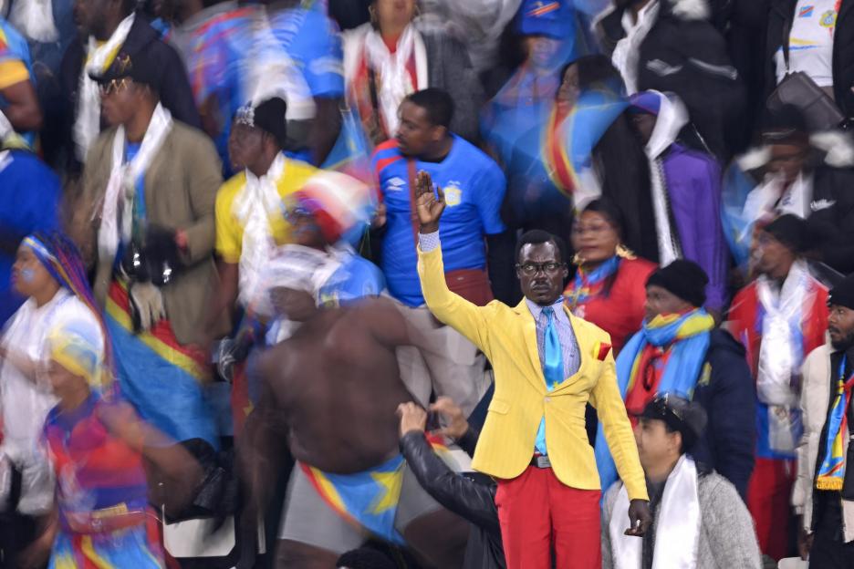 Democratic Republic of Congo football supporters cheer in the stands.