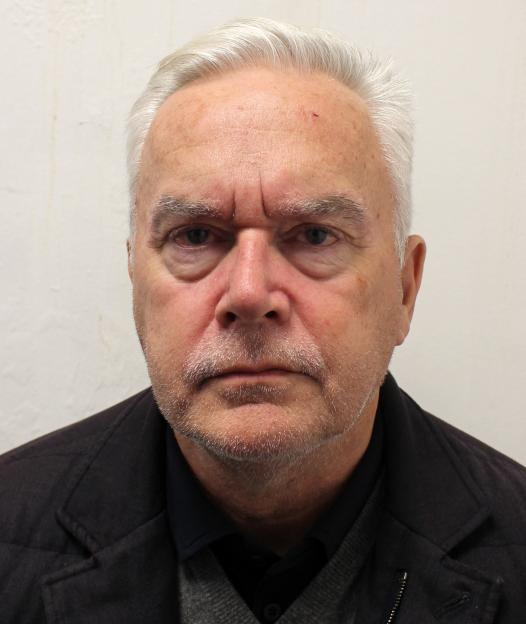 A headshot of Huw Edwards looking straight ahead.