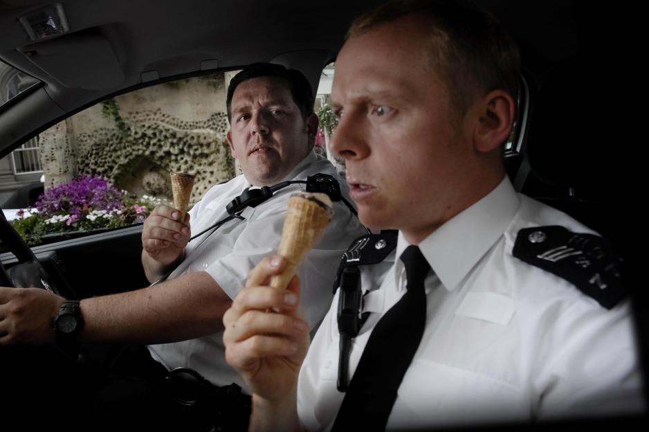 Nick Frost and Simon Pegg as police officers holding ice cream in "Hot Fuzz."