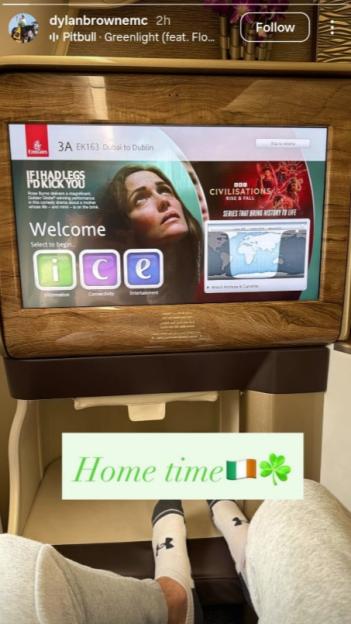 A view of an airplane entertainment screen showing Emirates flight EK163 from Dubai to Dublin, with text "Home time" and an Irish flag emoji and shamrock.