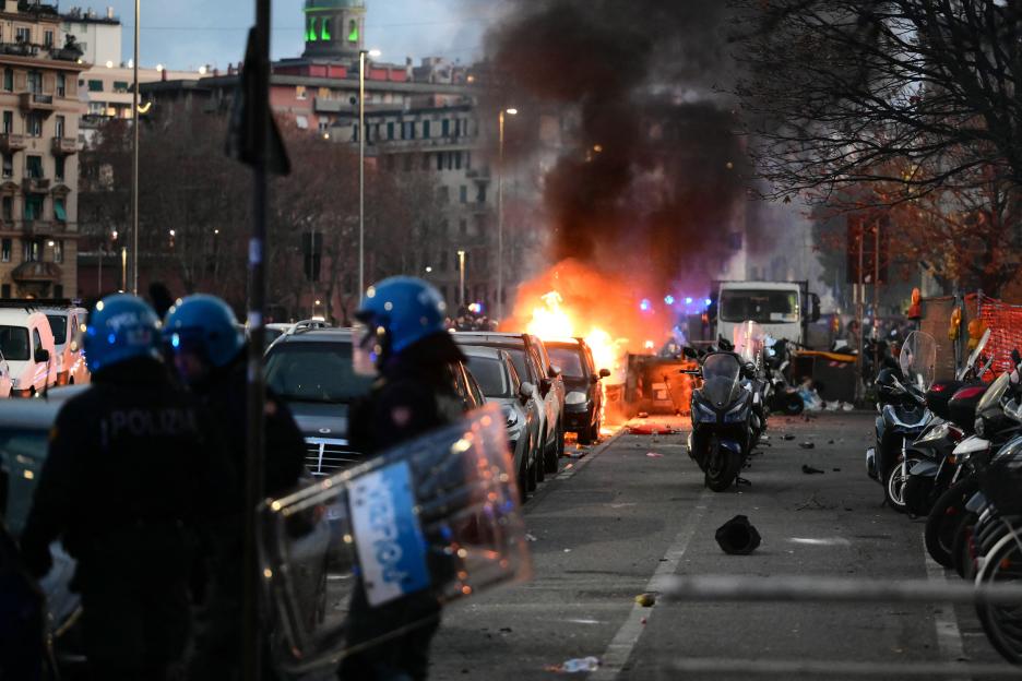 A vehicle burns outside the Luigi Ferraris stadium during clashes ahead of the Italian Serie A football match.