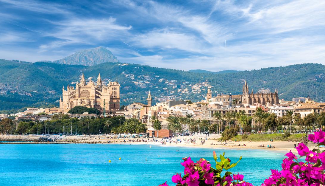 View of Palma de Mallorca town, Spain, with the cathedral and beach.