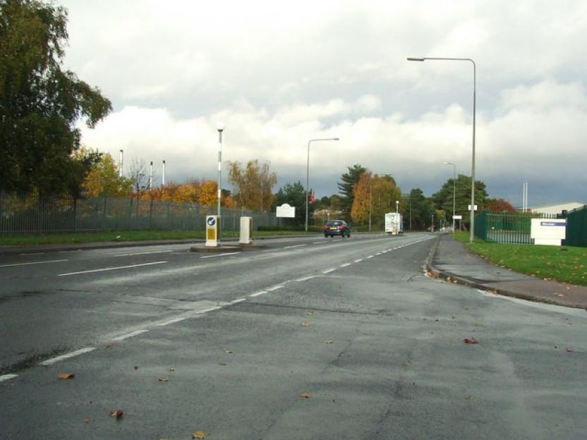 Road in Winfrith Newburgh with scattered leaves.