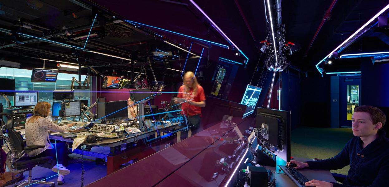 BBC Broadcasting House, London, United Kingdom. Architect: HOK International Ltd, 2014. View through to Radio 1 studio.