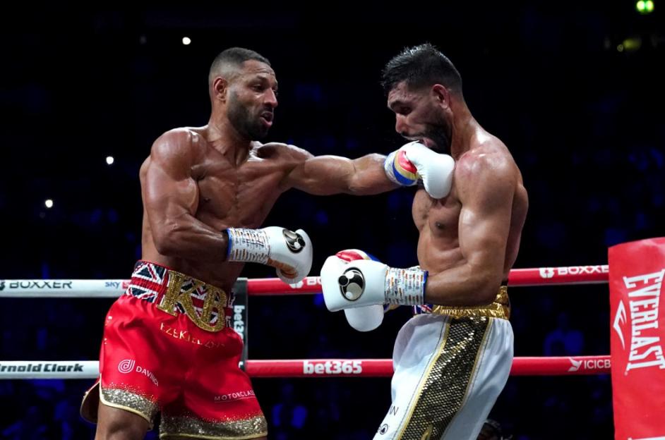 Boxer Kell Brook lands a punch on Amir Khan's face.