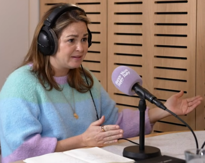 Roxie Nafousi speaking into a microphone for "Giovanna Fletcher's Happy Mum Happy Baby" podcast.