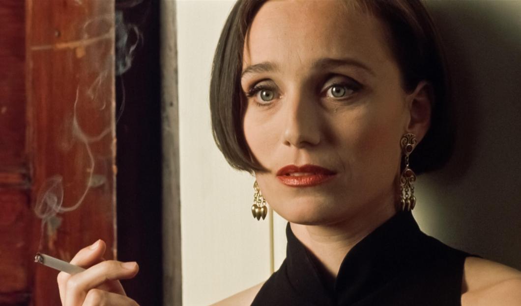 Kristin Scott Thomas in the film "Four Weddings and a Funeral" (1994) smoking a cigarette.