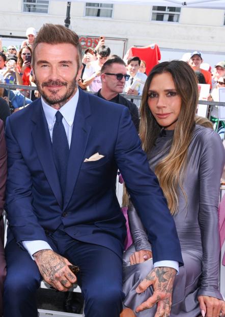 David and Victoria Beckham sitting together.