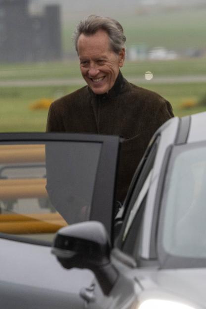 Richard E. Grant smiling as he arrives in Inverness to film "Celebrity Traitors."