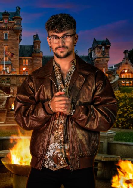 Jack, a 29-year-old personal trainer from Essex, poses in front of a castle.