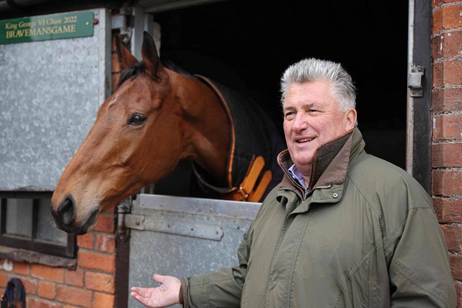 Paul Nicholls with Bravemansgame at his stables.