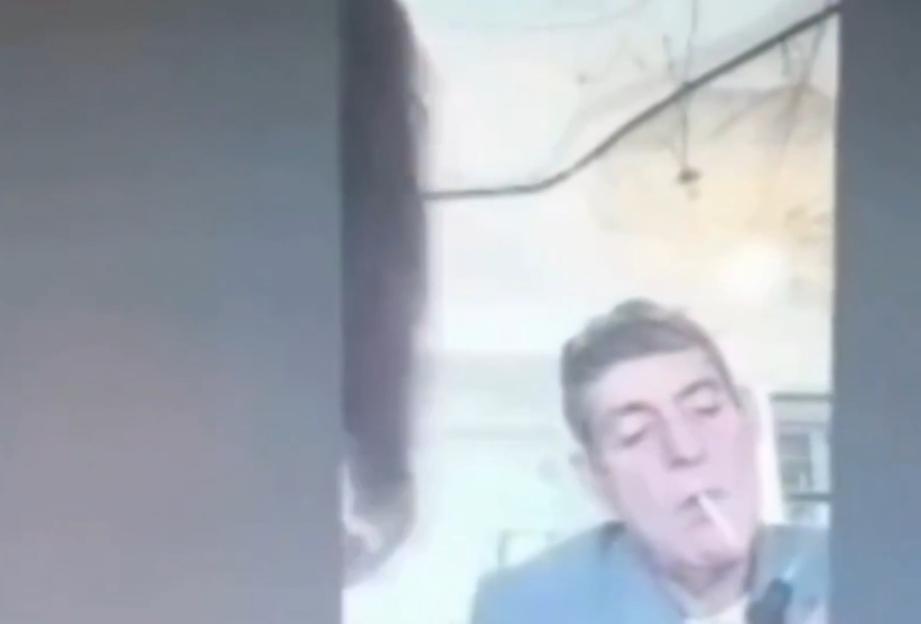 VIDEO: Judge necks wine from bottle and lights cigarette with blowtorch during live hearing