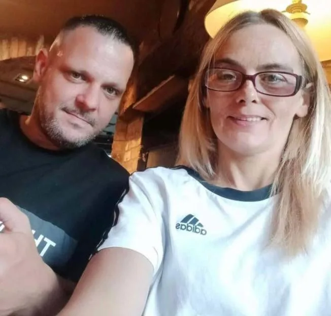 James and a woman smiling together.