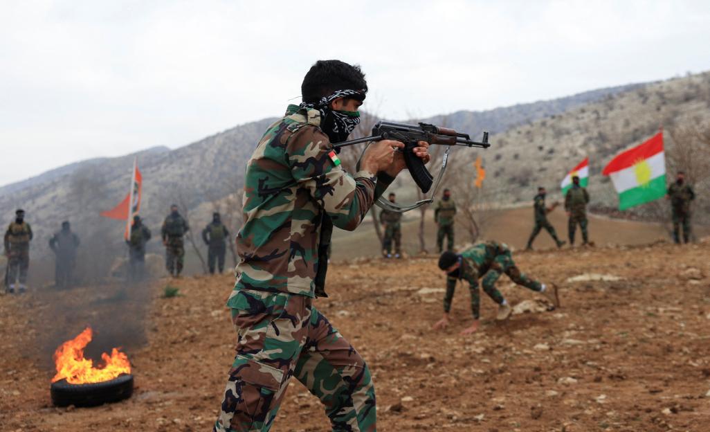 : Iranian Kurdish fighters from the Kurdistan Freedom Party (PAK) take part in a training session at a base on the outskirts of Erbil