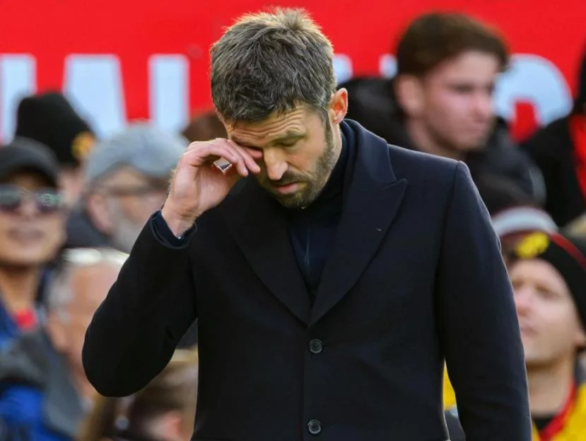 Manchester United Manager Michael Carrick looks disappointed on the pitch.
