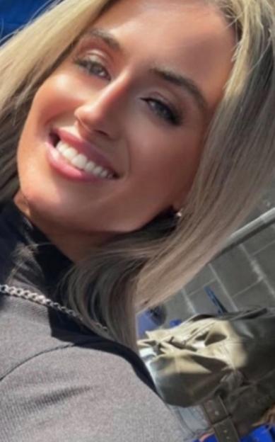 Paula Edgar, 34, smiling.