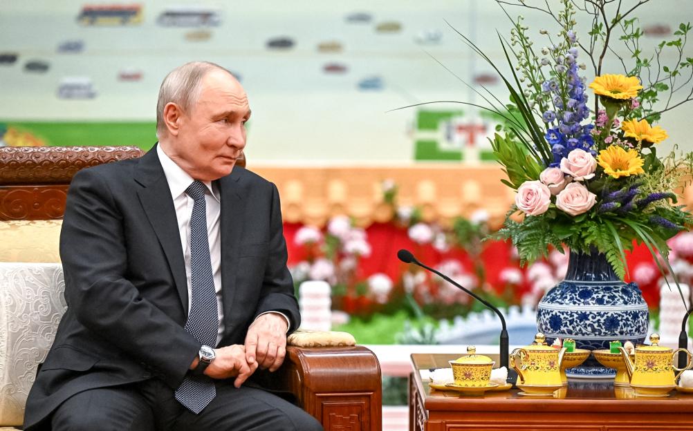 Vladimir Putin at a tea chat with China's President in Beijing.