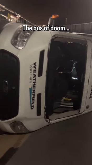 A white van from Weatherfield Van Hire on its side with the text "The bus of doom..."