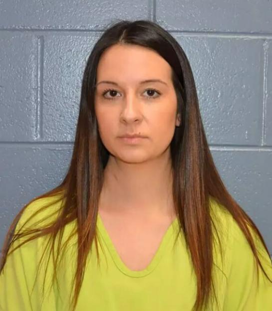 A woman with long dark hair and a lime green shirt.