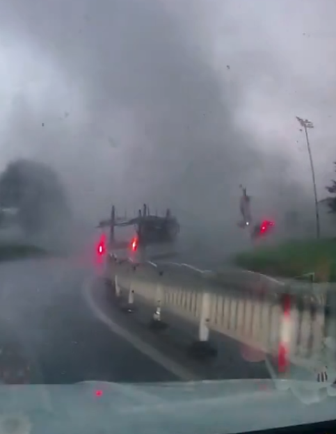 A van is tossed by a weak tornado in Haining, Zhejiang Province.