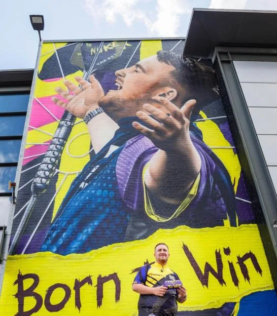 30th July 2026, Warrington, UK. After successfully defending his World Matchplay title and breaking Phil Taylor's historic tournament average record, Luke Littler returned to his home town of Warrington to unveil a brand-new MurWalls mural created in