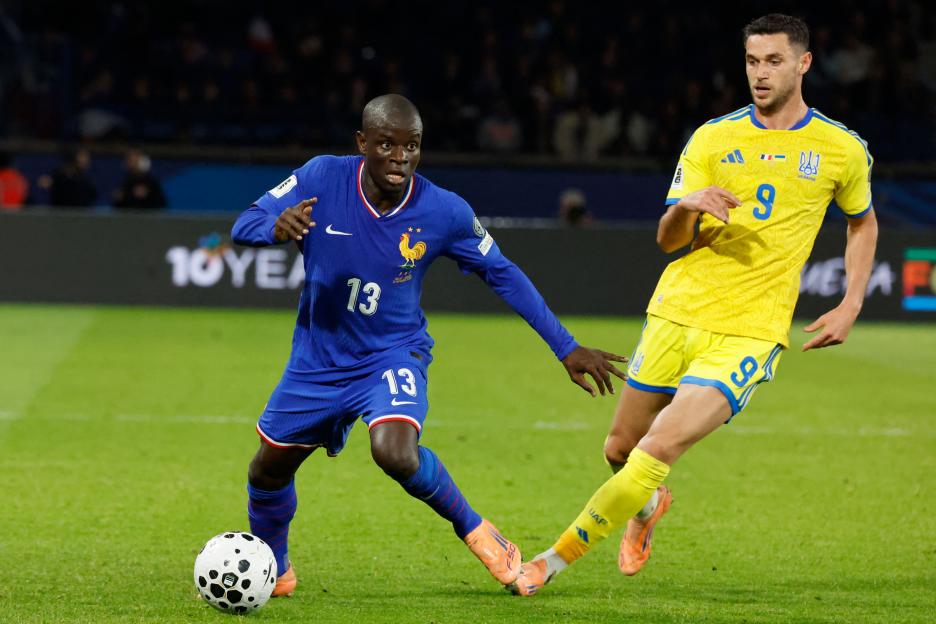 N'Golo Kante of France dribbles the soccer ball past Ukraine's Oleksii Hutsuliak during a World Cup qualifying match.